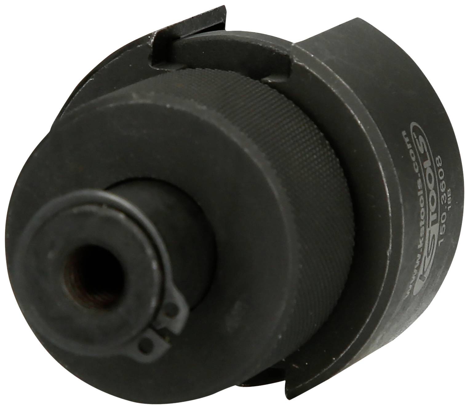 Ein schwarzes zylindrisches Metallwerkzeug mit geriffelter Oberfläche und kleiner Öffnung, möglicherweise eine Bohrer- oder Düseneinheit.