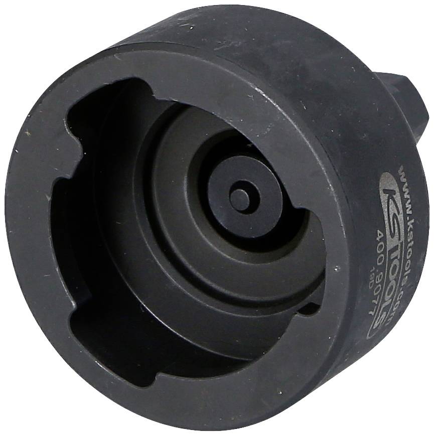Schwarzes, rundes Werkzeugteil aus Metall mit inneren Aussparungen und Markierungen. Genutzt für technische oder mechanische Anwendungen.