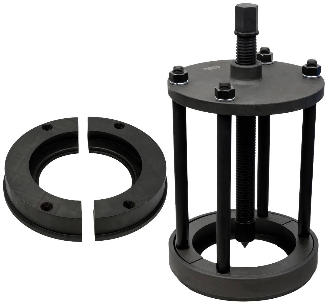 Großes schwarzes Abziehwerkzeug mit Schraube und Sicherungsmuttern, daneben ein geteilter Ring. Wird verwendet, um Teile vorsichtig auseinanderzuziehen.