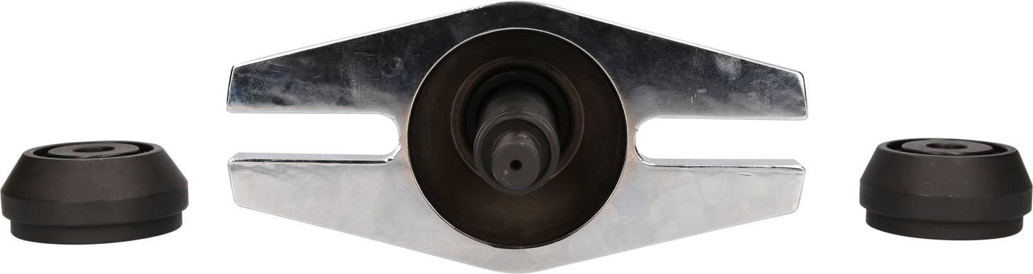 Metallwerkzeug mit zentralem Loch und zwei abgerundeten Endkappen. Möglicherweise für Montage- oder Reparaturarbeiten verwendet.