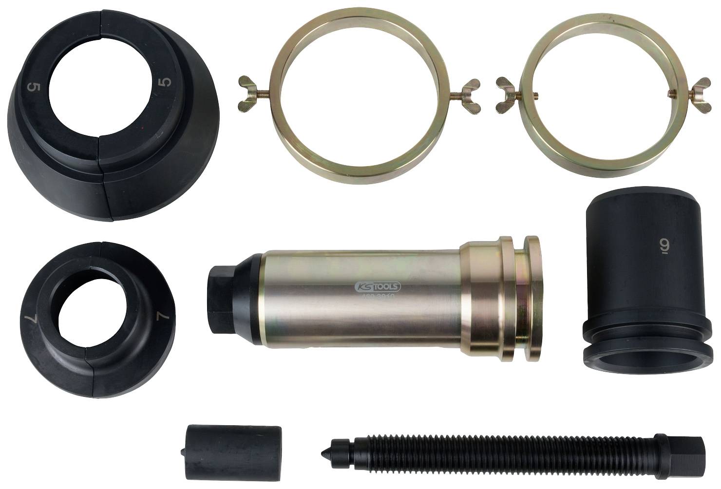 Zerlegtes Werkzeug-Set mit verschiedenen Metall- und Kunststoffteilen, darunter Ringe, Hülsen, Schraube und Adapter; vermutlich für mechanische Arbeiten.