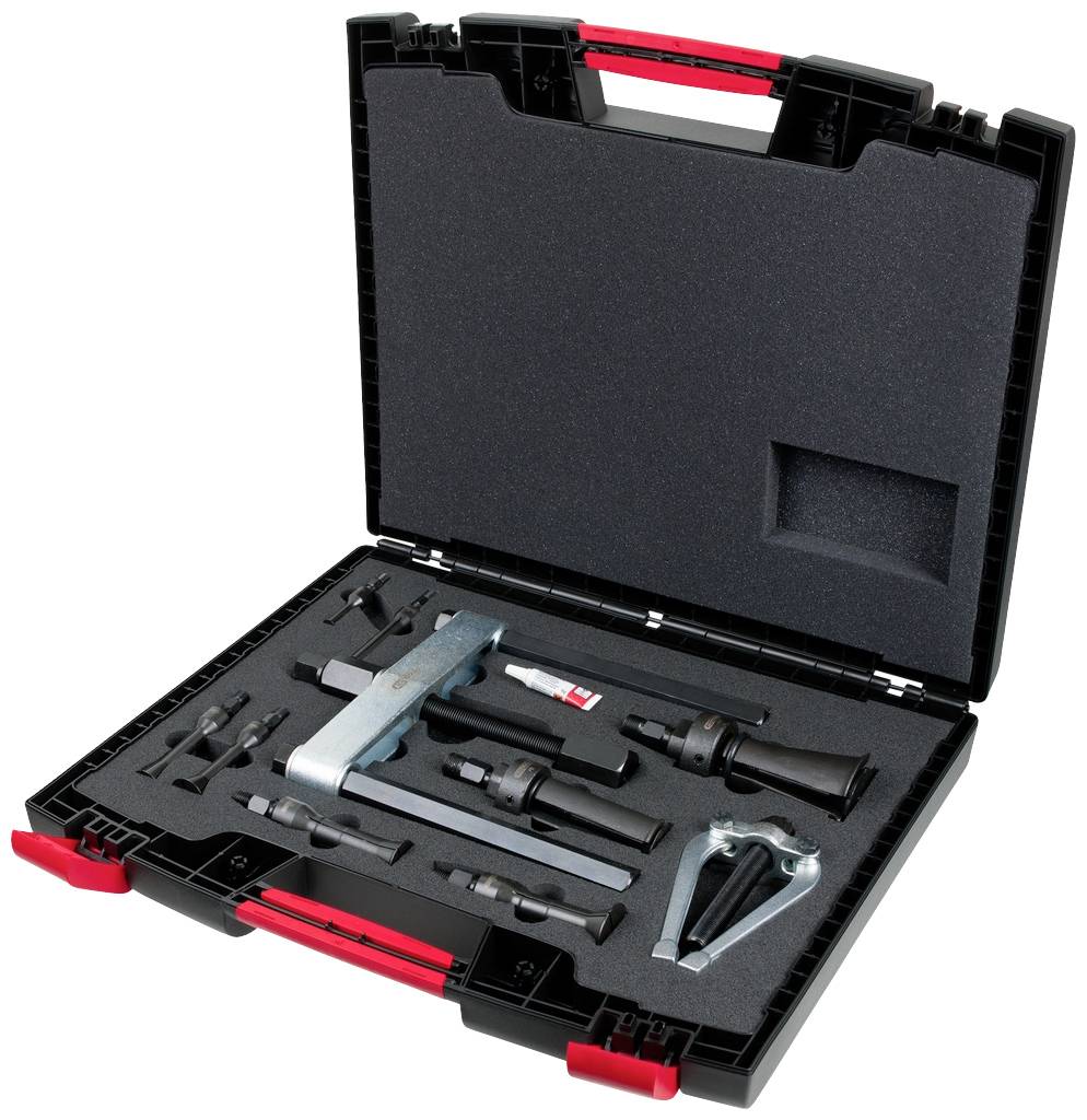 Werkzeugkoffer mit verschiedenen mechanischen Werkzeugen, darunter ein Schraubenschlüssel, eine Zange und einige Schrauben, ordentlich angeordnet.