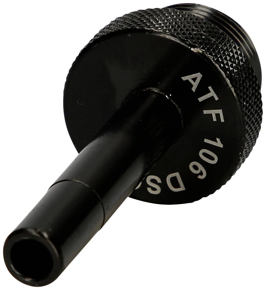 Schwarzes Metallteil mit zylindrischem Hals, seitlich graviert mit 'ATF 106'. Vermutlich technisches Zubehör, Nahaufnahme.
