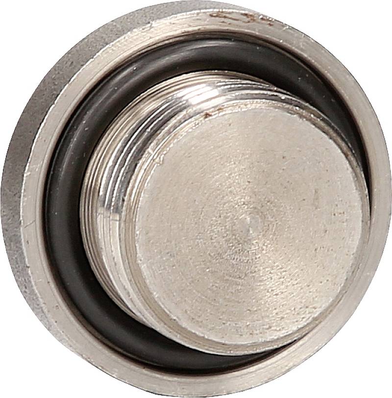 Eine silberne, runde Metallkappe mit einem schwarzen Gummiring, möglicherweise Teil eines Ventils oder einer technischen Vorrichtung.