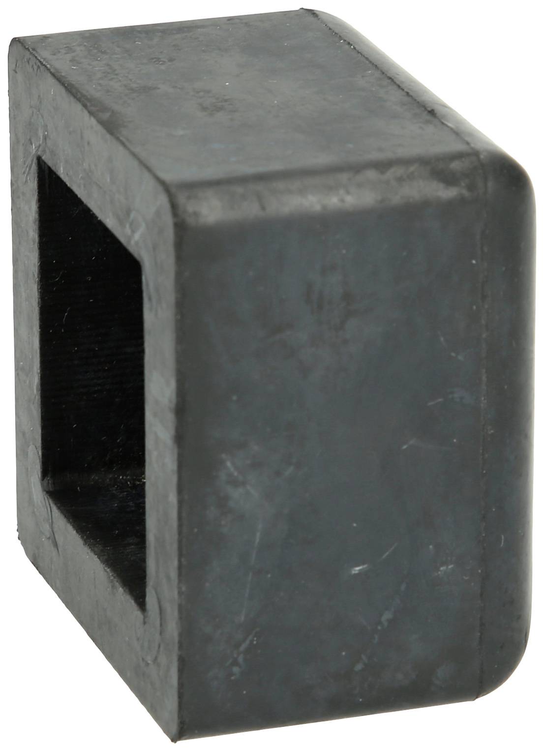 Ein schwarzer, quadratischer Kunststoffstopfen mit offener Seite.