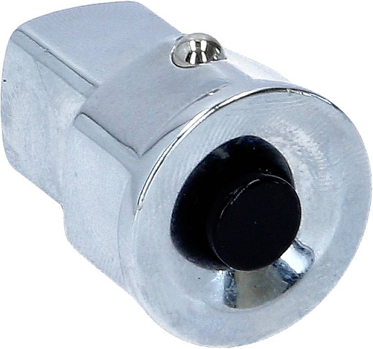 Ein silberner, zylindrischer Metallknopf mit einem schwarzen, runden Druckknopf in der Mitte, montiert auf einer Metallfläche.