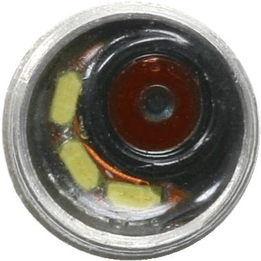 Ein kleines, rundes technisches Bauteil mit rotem, kreisförmigem Zentrum und umgeben von gelben und kupferfarbenen Elementen.