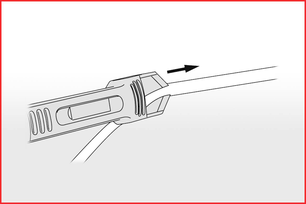 Ein Kabel wird durch einen Werkzeugschlitz in eine Richtung gezogen, angezeigt durch einen Pfeil.