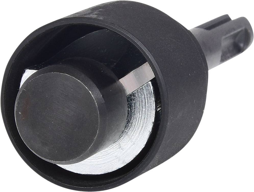 Nahaufnahme einer schwarzen Kunststoffkappe mit integriertem Metallzylinder, möglicherweise ein Bauteil technischer Geräte.