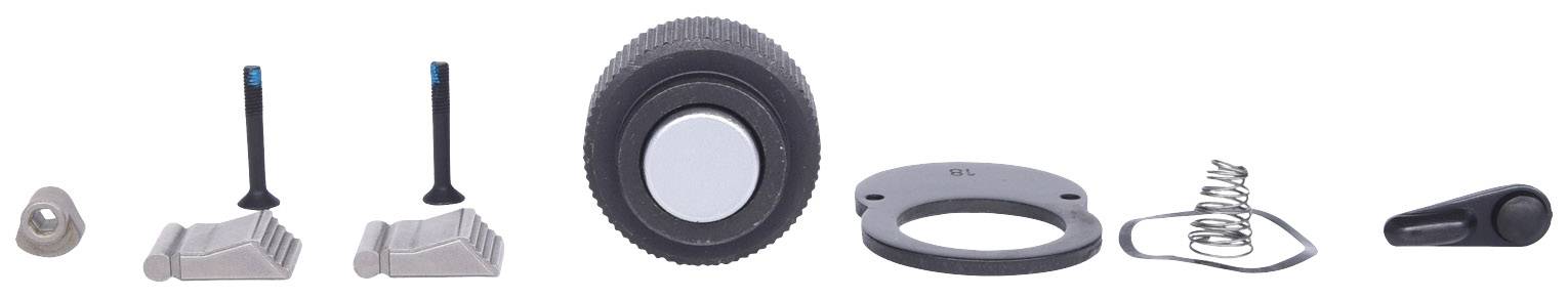 Auto-Ersatzteile auf weißem Hintergrund, darunter Ventile, Griffe, Dichtungen und Federn. Zeigt verschiedene Komponenten eines Fahrzeugs.