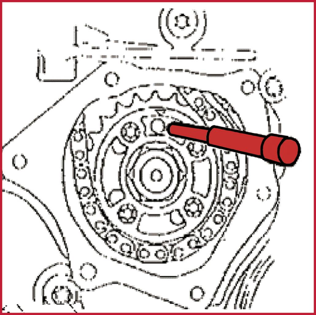 Ein Diagramm zeigt das Innere eines Motorteils mit einem roten Werkzeug, das auf ein Zahnrad zeigt, vermutlich zur Reparaturanleitung.