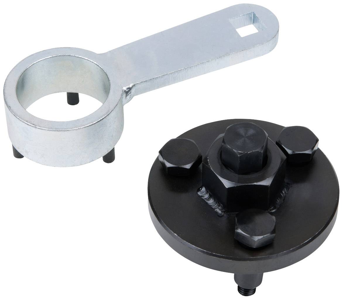 Ein Abzieherwerkzeug-Set, bestehend aus einem metallischen Hebelarm und einer runden, schwarzen Platte mit mehreren Bolzen.