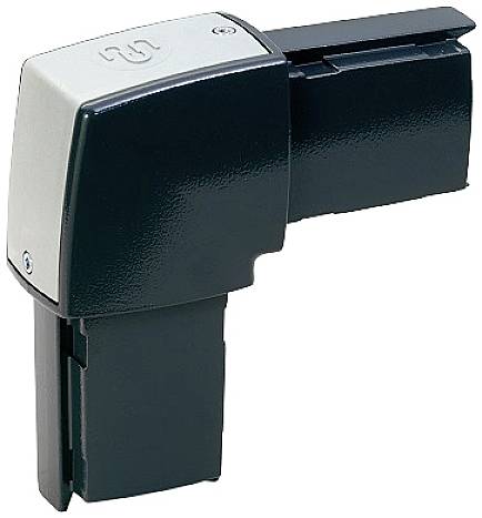 Ein schwarzes, L-förmiges Gerät mit einem silbernen Oberteil. Es scheint ein technisches Bauteil oder Werkzeug zu sein.