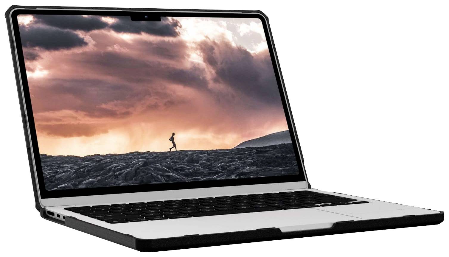 Ein Laptop mit einem Bildschirmschoner, der eine Person zeigt, die bei Sonnenuntergang auf vulkanischem Gestein läuft.