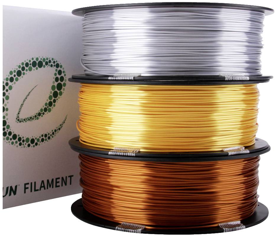 Drei Rollen farbiges Filament liegen aufeinander: oben Silber, in der Mitte Gold und unten Kupfer. Links ist eine Verpackung mit Logo.