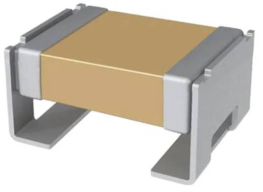 Eine oberflächenmontierte elektronische Komponente mit rechteckigem hellbraunem Gehäuse und metallischen Anschlüssen auf jeder Seite. Montiert auf einer ebenen Oberfläche.