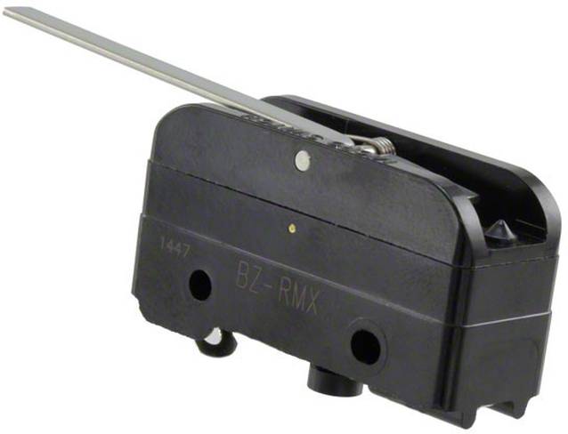 Ein rechteckiges, zweifarbiges Objekt mit beigem Zentralbereich und grauen Metallenden, das einer großen elektronischen Komponente ähnelt, vor einem einfachen Hintergrund.