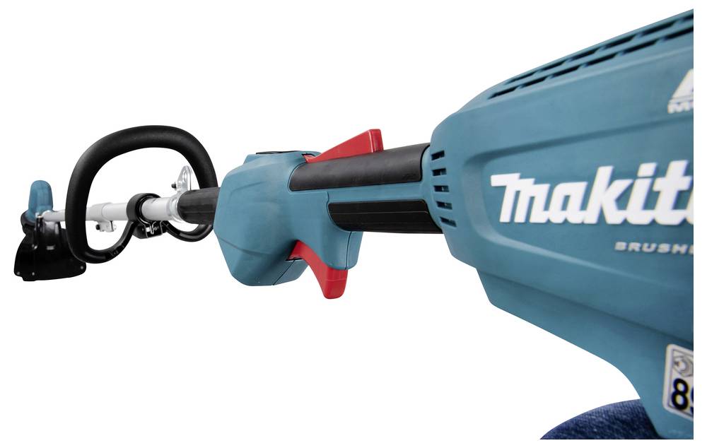 Eine Nahaufnahme eines blauen Makita bürstenlosen Werkzeugs, die seinen Griff und einen Teil seines Gehäuses zeigt.