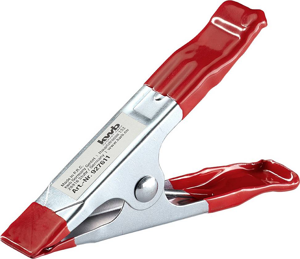 Eine rote Batterieklemme aus Metall mit einem Etikett auf der Seite.