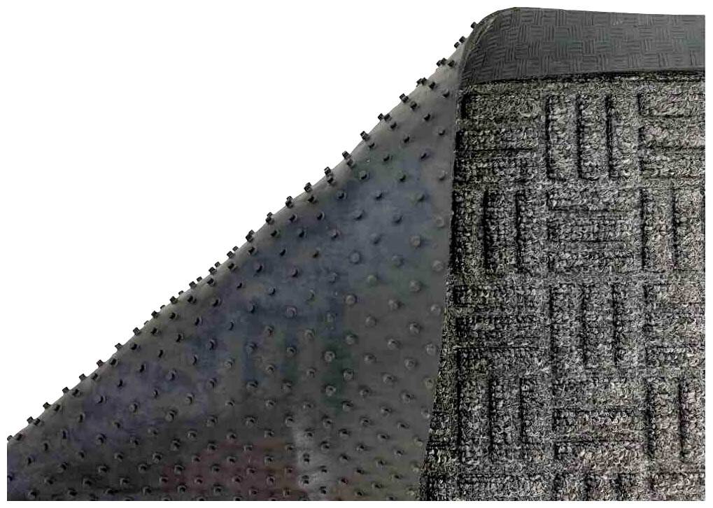 Ein umgedrehter Teppich mit rutschfester Unterseite und erhabenen Punkten zur besseren Haftung auf dem Boden.