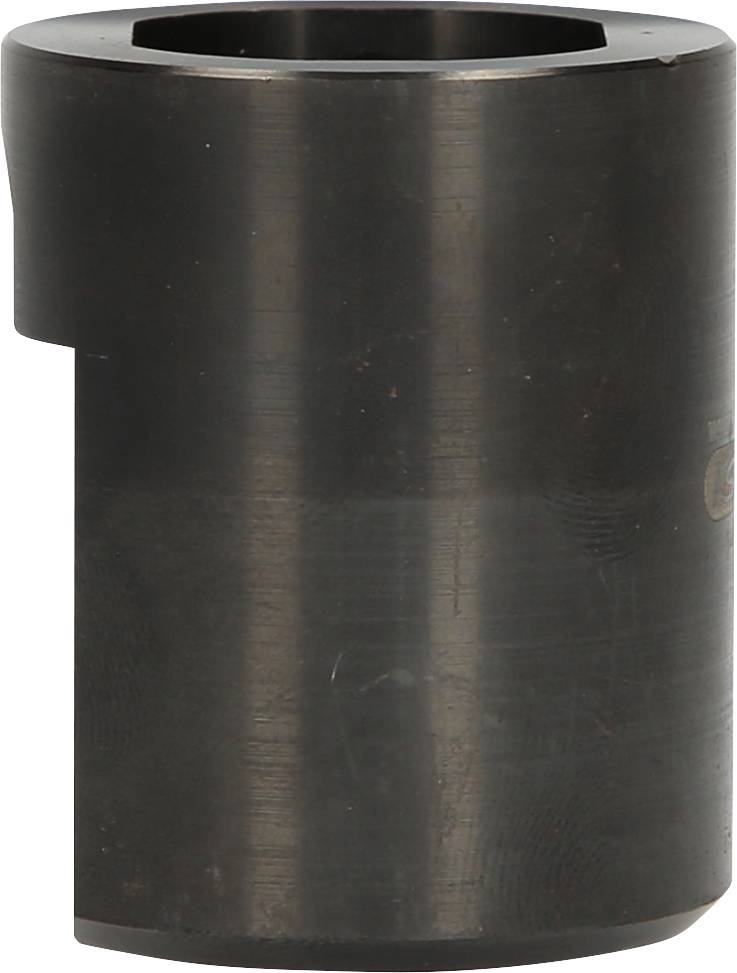 Ein zylindrisches Metallteil, vermutlich ein spezieller Schlüssel oder Werkzeugaufsatz, aus schwarzem Material, mit sechseckiger Öffnung oben.