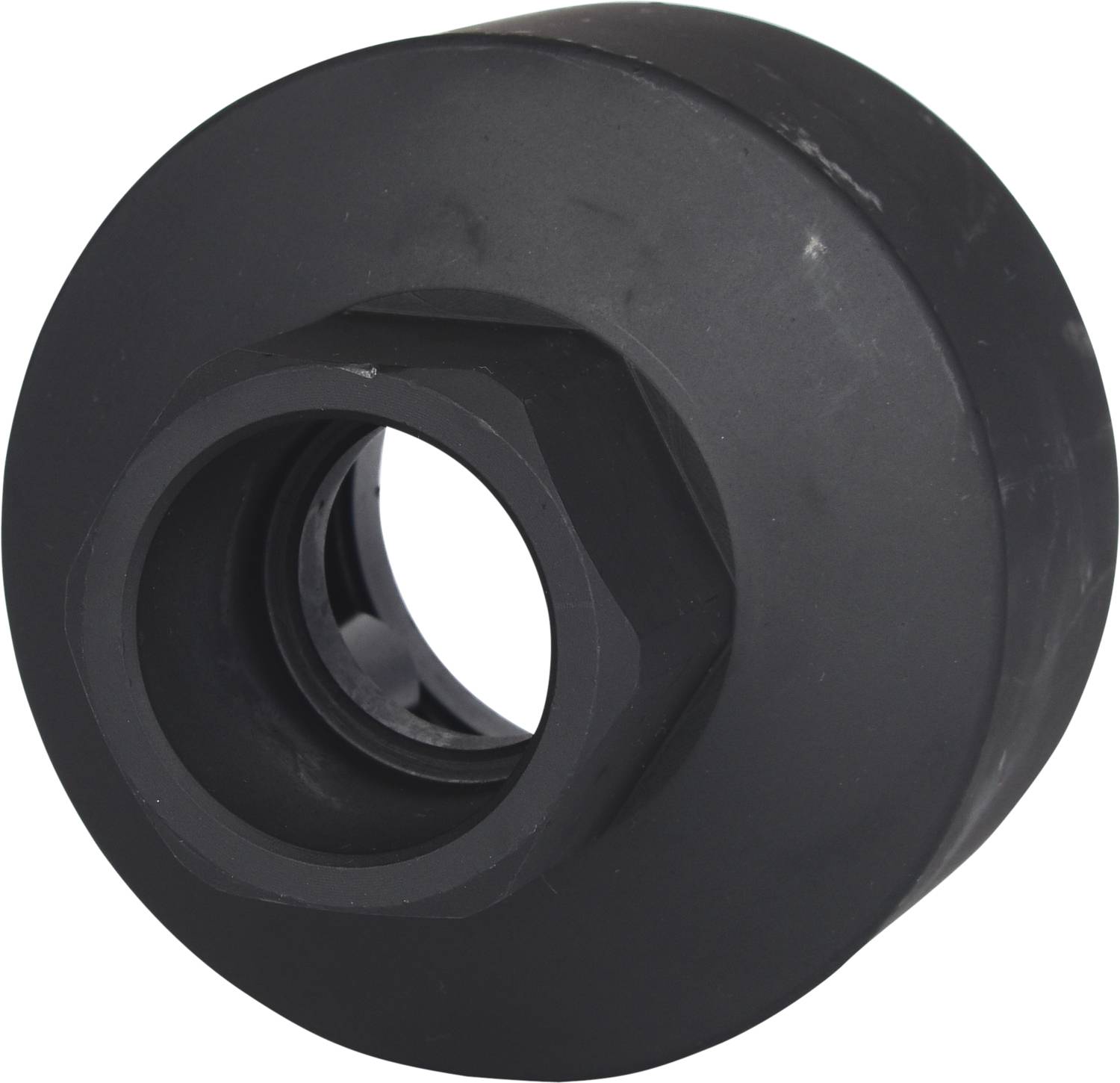 Eine schwarze Rolle oder Rad aus einem festen Material, wahrscheinlich für ein Skateboard oder ähnliches Gefährt.