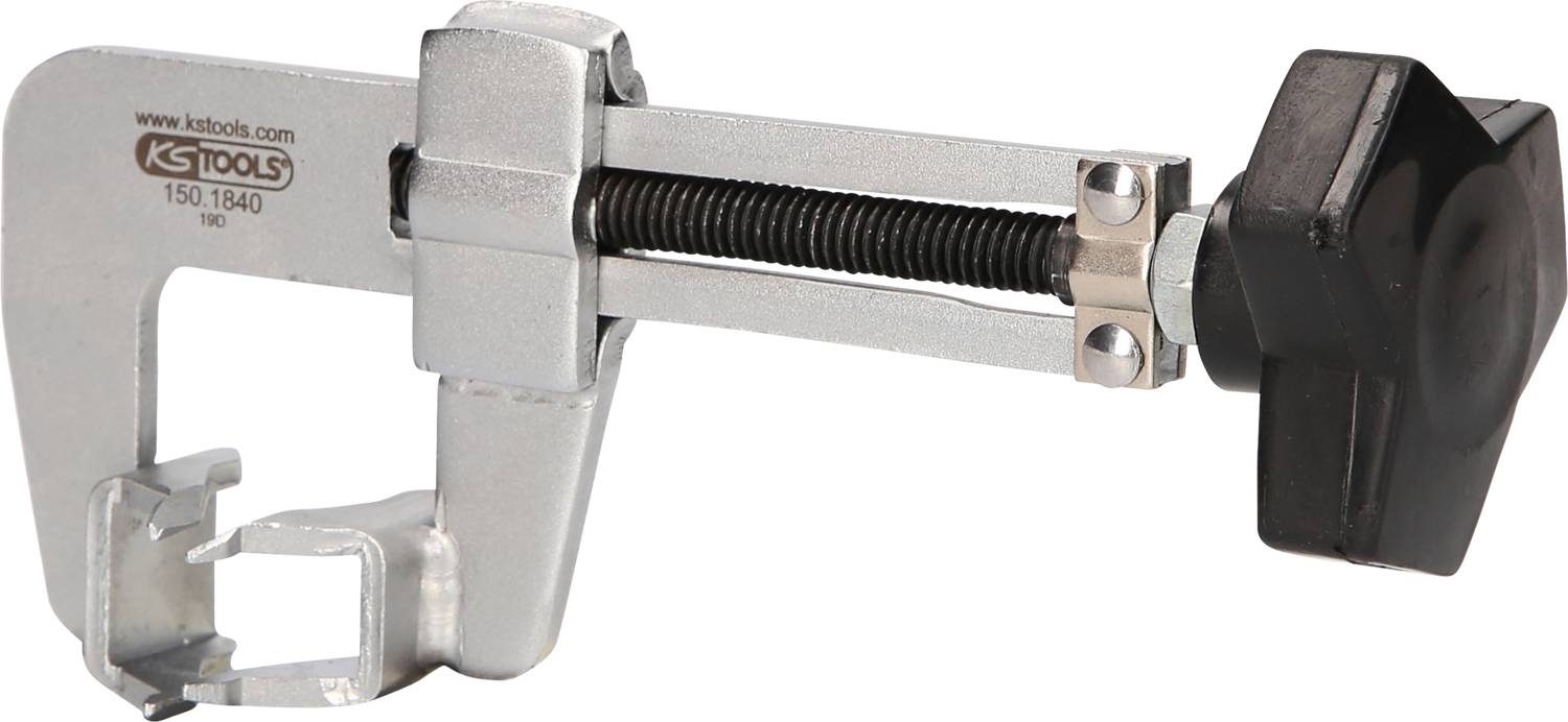 Silberne Bremskolben-Rückstellvorrichtung mit schwarzem Griff in seitlicher Ansicht. Werkzeug zur Wartung von Bremssystemen.