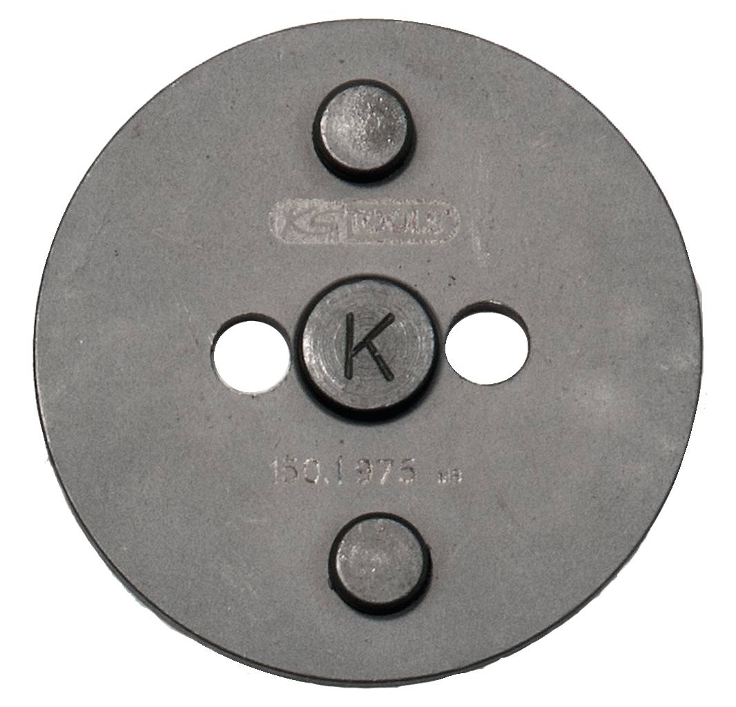 Kreisförmige Metallplatte mit drei runden Erhebungen und der Gravur '150,175' sowie einem markanten 'K' in der Mitte.