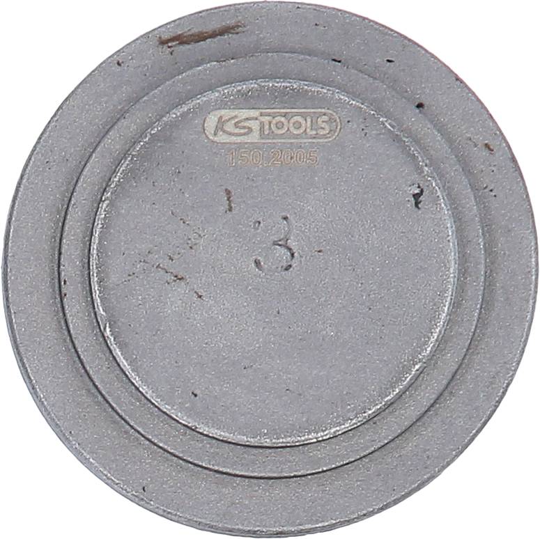 Ein runder, metallischer Werkstattgegenstand mit der Aufschrift 'KS TOOLS 150.2105' und der Zahl '3' in der Mitte.