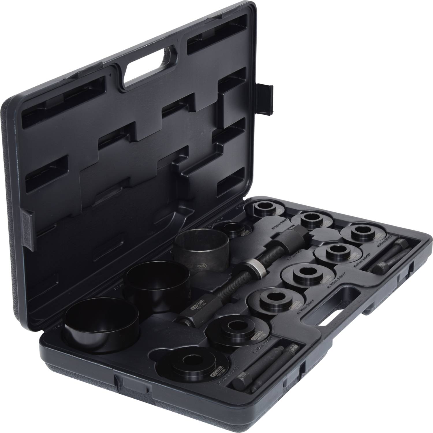 Ein schwarzer Werkzeugkoffer mit verschiedenen runden Aufsätzen und Zubehörteilen, regelmäßig angeordnet, zur Fahrzeugreparatur.