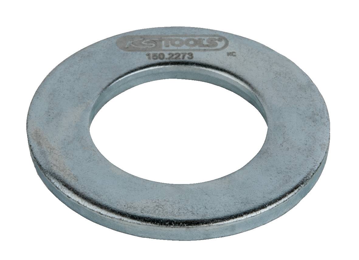 Eine runde Metallscheibe mit großem mittlerem Loch, markiert mit 