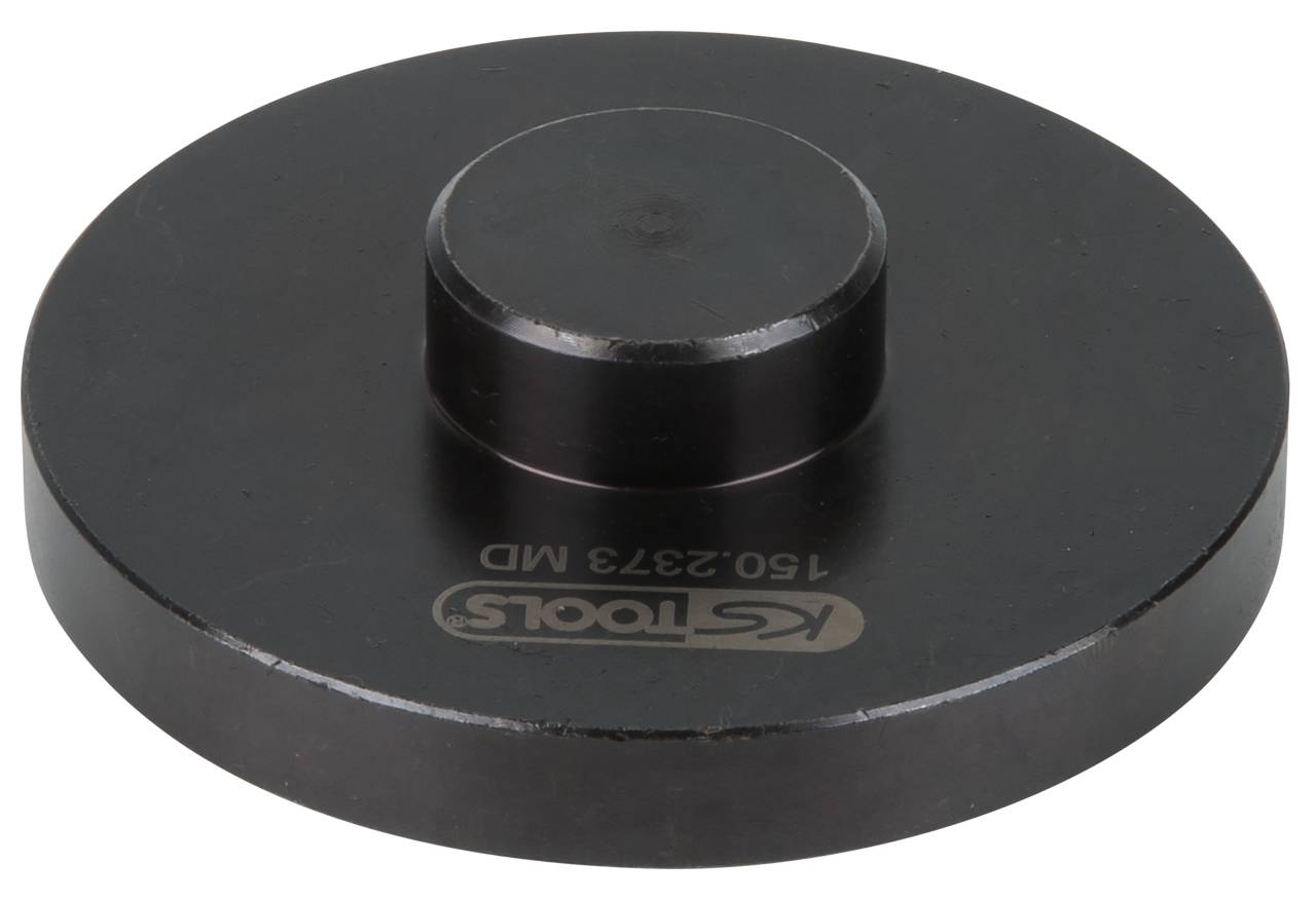 Schwarzes Metallwerkzeug mit zylindrischem zentralen Vorsprung und abgerundeten Kanten. Logo und Seriennummer sind eingraviert.