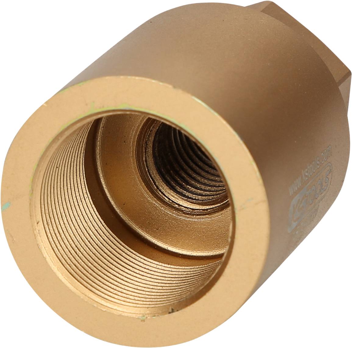 Ein bronzefarbenes, zylindrisches Metallstück mit einem Innengewinde, möglicherweise ein Maschinenteil oder Adapter.