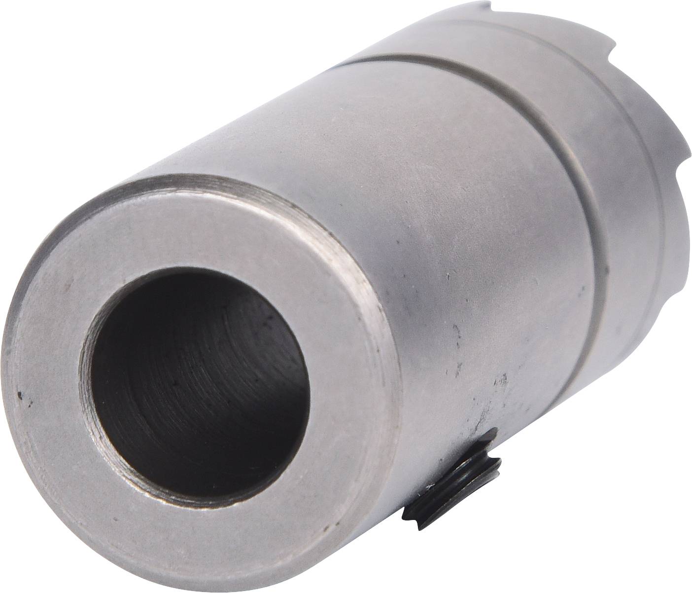Silberner Metallzylinder mit abgeschrägter Kante, wahrscheinlich Teil einer mechanischen Vorrichtung oder eines Werkzeugs.