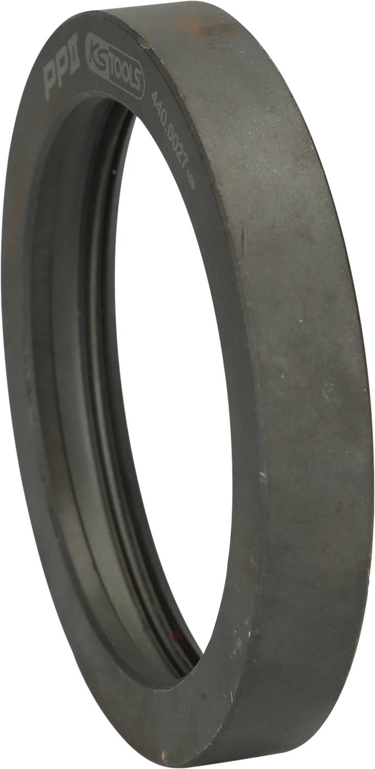 Rundes Metallobjekt mit Markierung 'K-Tools', möglicherweise ein Teil eines Werkzeugs oder Maschinenbestandteils, grau gefärbt.