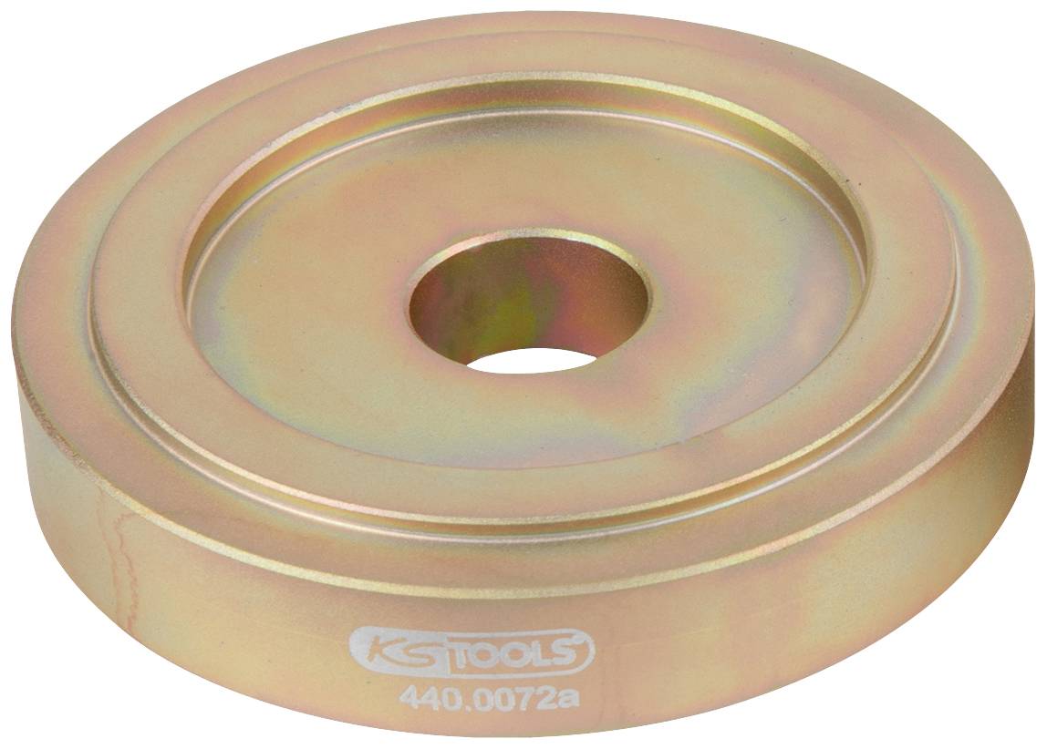 Metallscheibe mit Loch in der Mitte, verwendet als Werkzeugaufsatz. Goldfarbene Oberfläche mit leichtem Regenbogeneffekt.