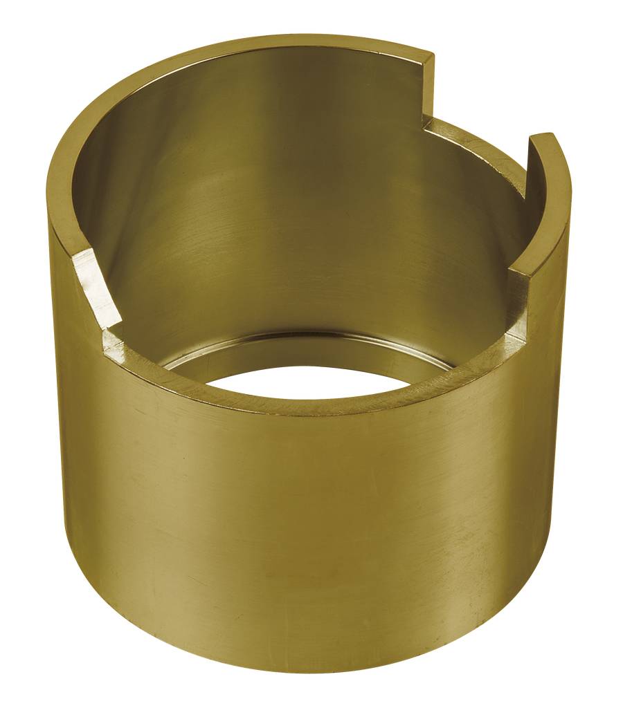 Ein zylindrisches Messingteil mit einem Schlitz an der Oberseite.