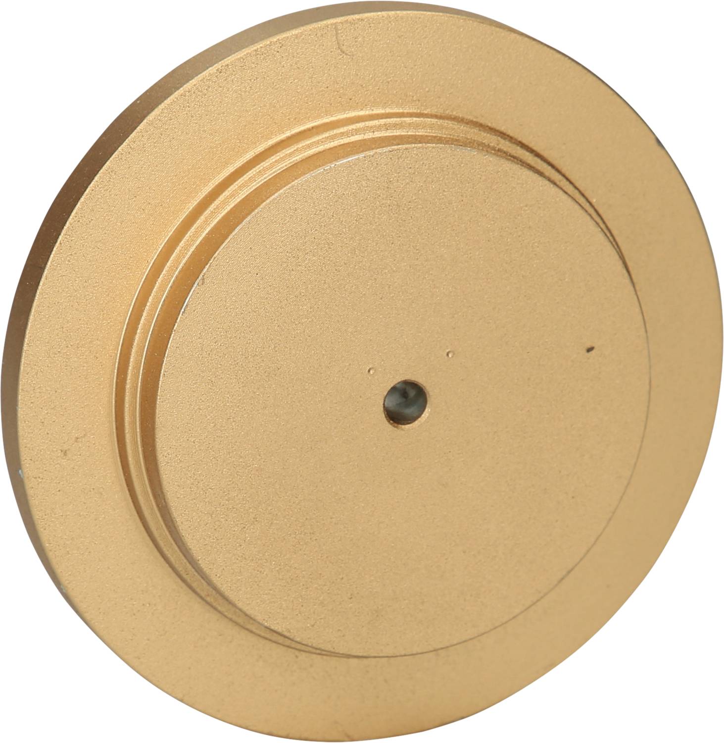 Runder, goldfarbener Metallkreis mit leicht erhabener Mitte und kleinem schwarzen Punkt in der Mitte.