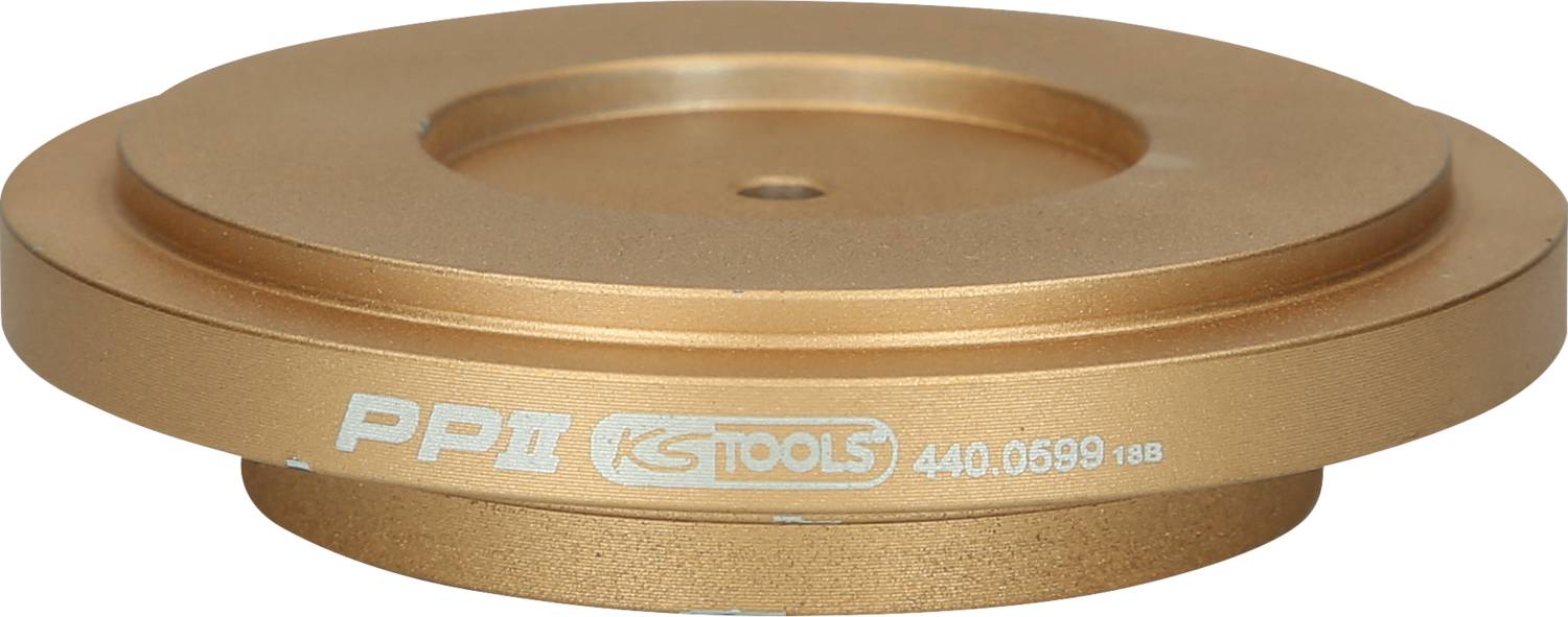 Ein bronzefarbener Metalladapter mit der Aufschrift 'PP II' und 'KS TOOLS'. Er hat eine runde Form und wird in der Werkstatttechnik verwendet.
