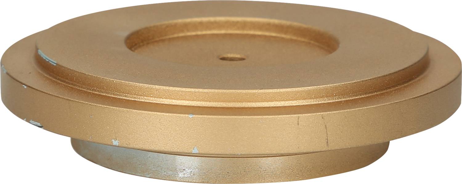 Ein rundes, goldenes Metallobjekt mit zwei übereinander liegenden Scheiben. Es wirkt industriell und funktional.