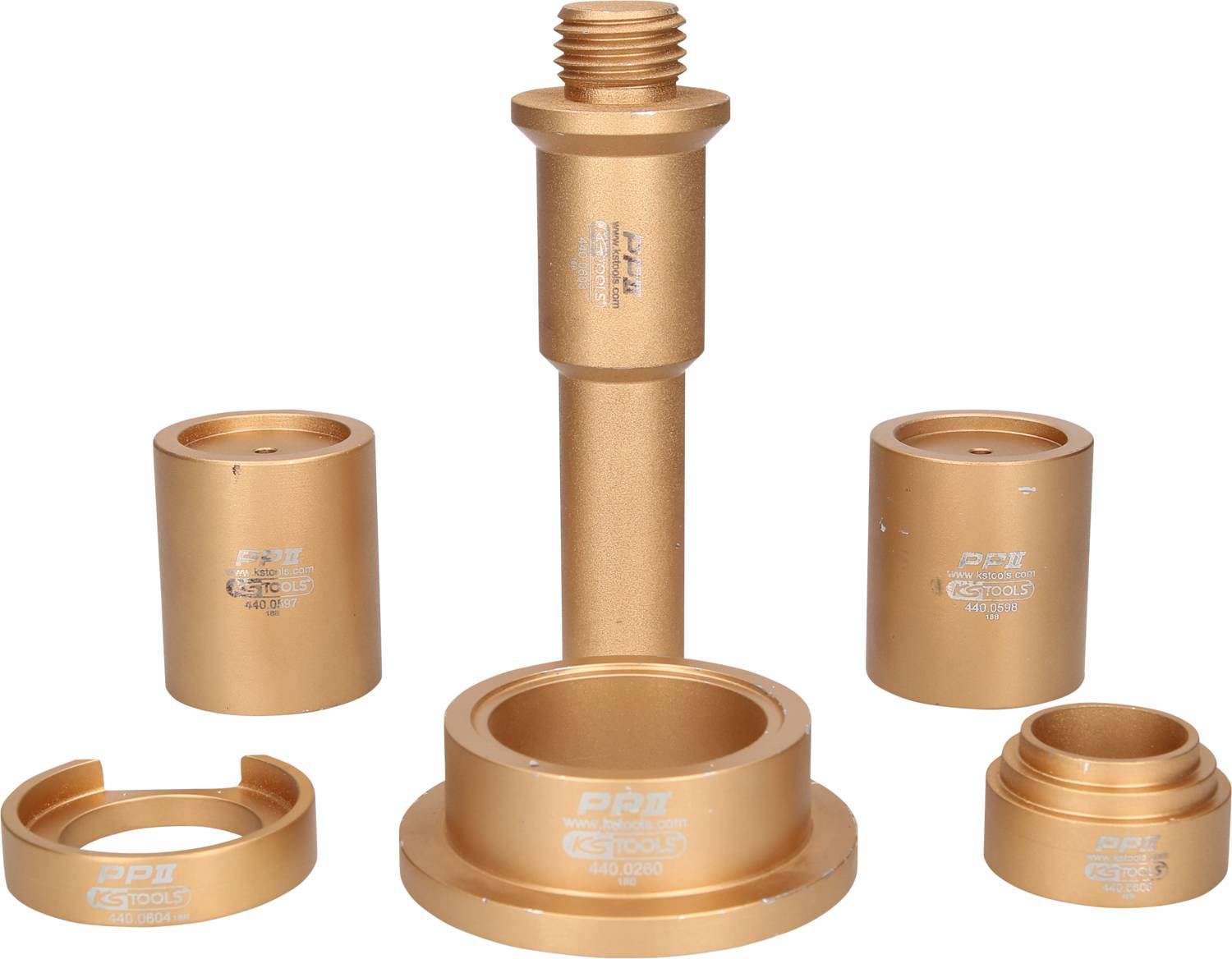 Fünf goldene Fahrradlageradapter in verschiedenen Größen, symmetrisch angeordnet; zentraler Adapter ist am höchsten.