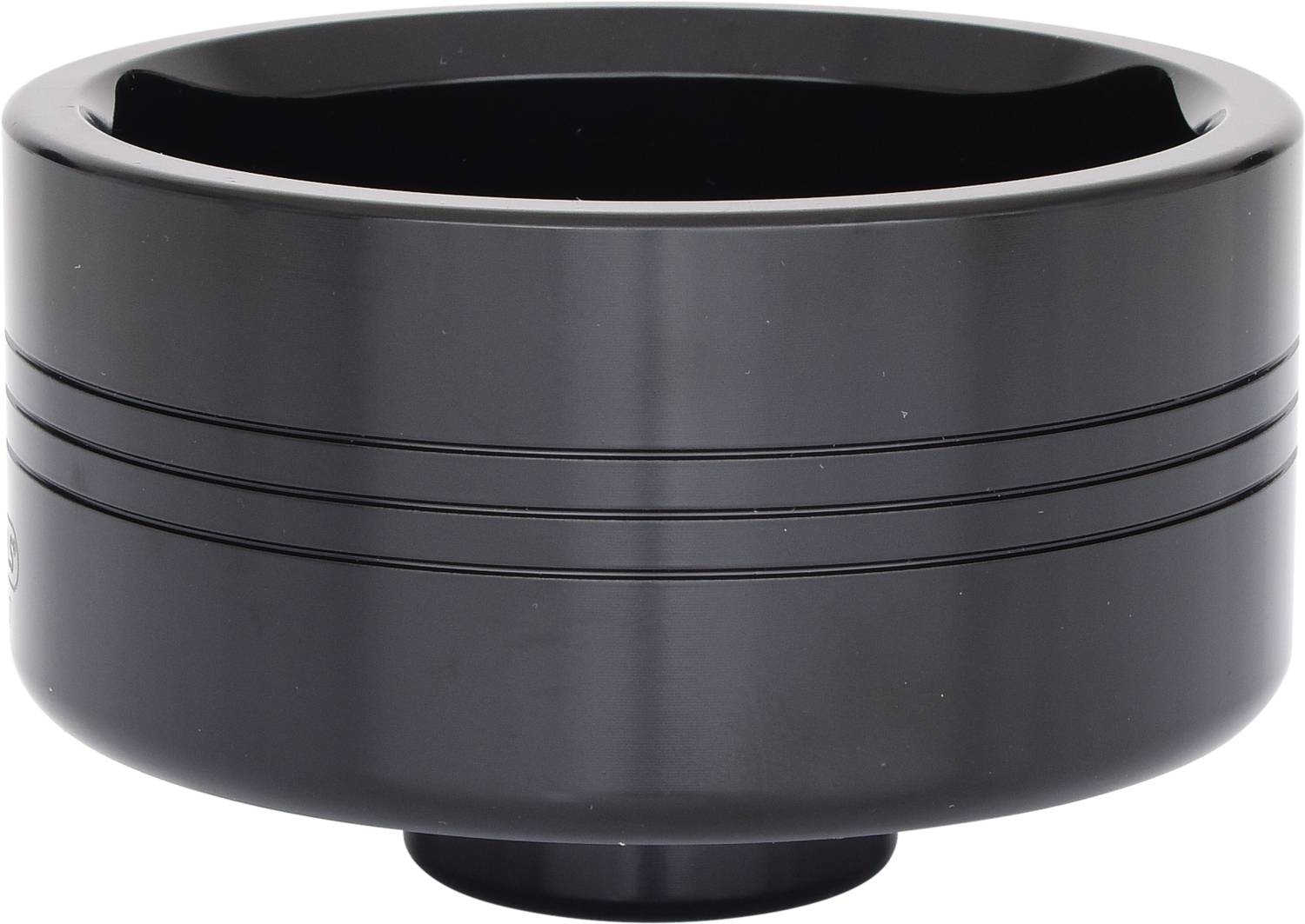 Eine schwarze Metalllinse mit vertikalen Rillen an den Seiten.