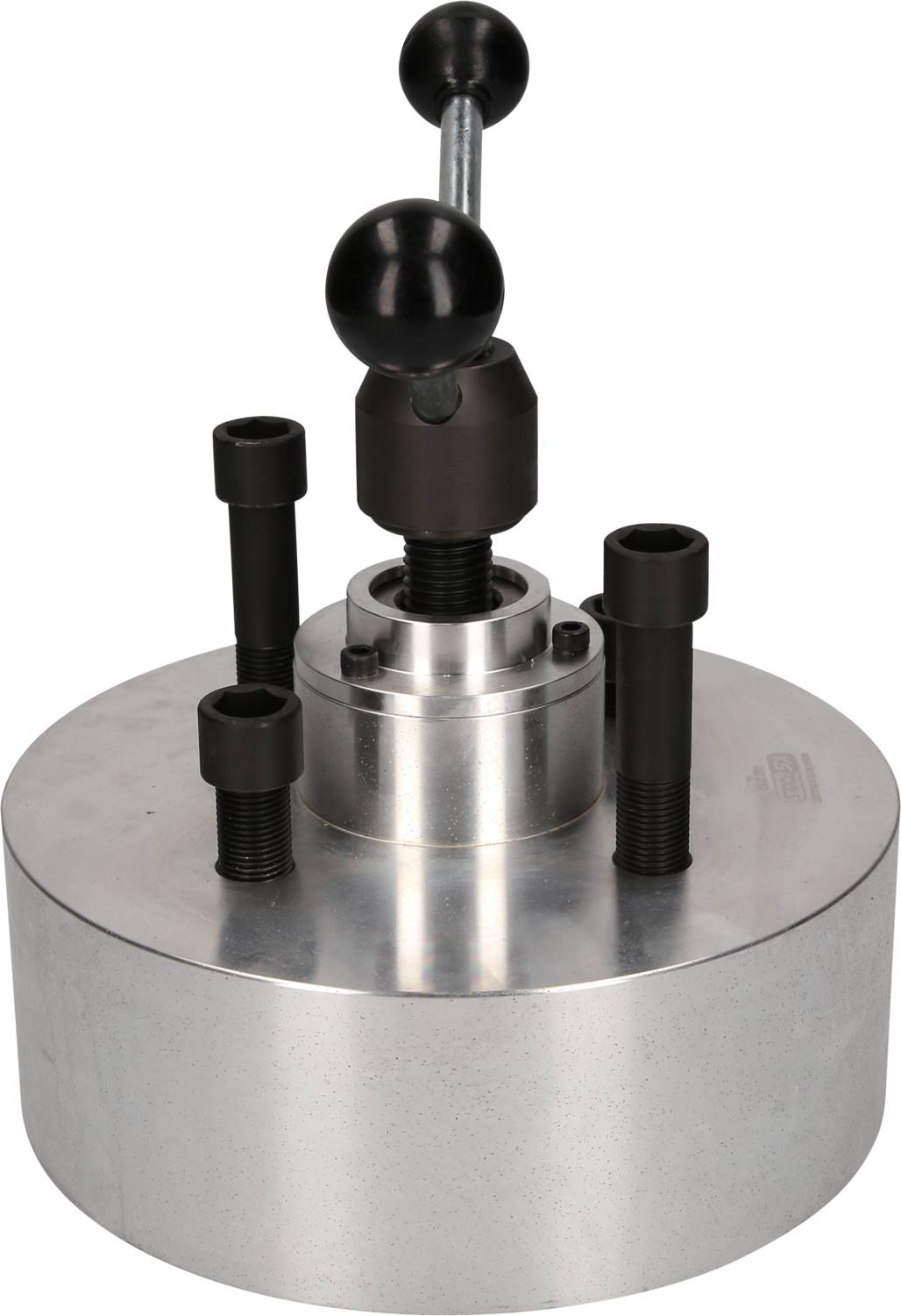 Metallisches Werkzeug mit rundem Sockel und Hebelgriff, möglicherweise für mechanische oder industrielle Anwendungen.