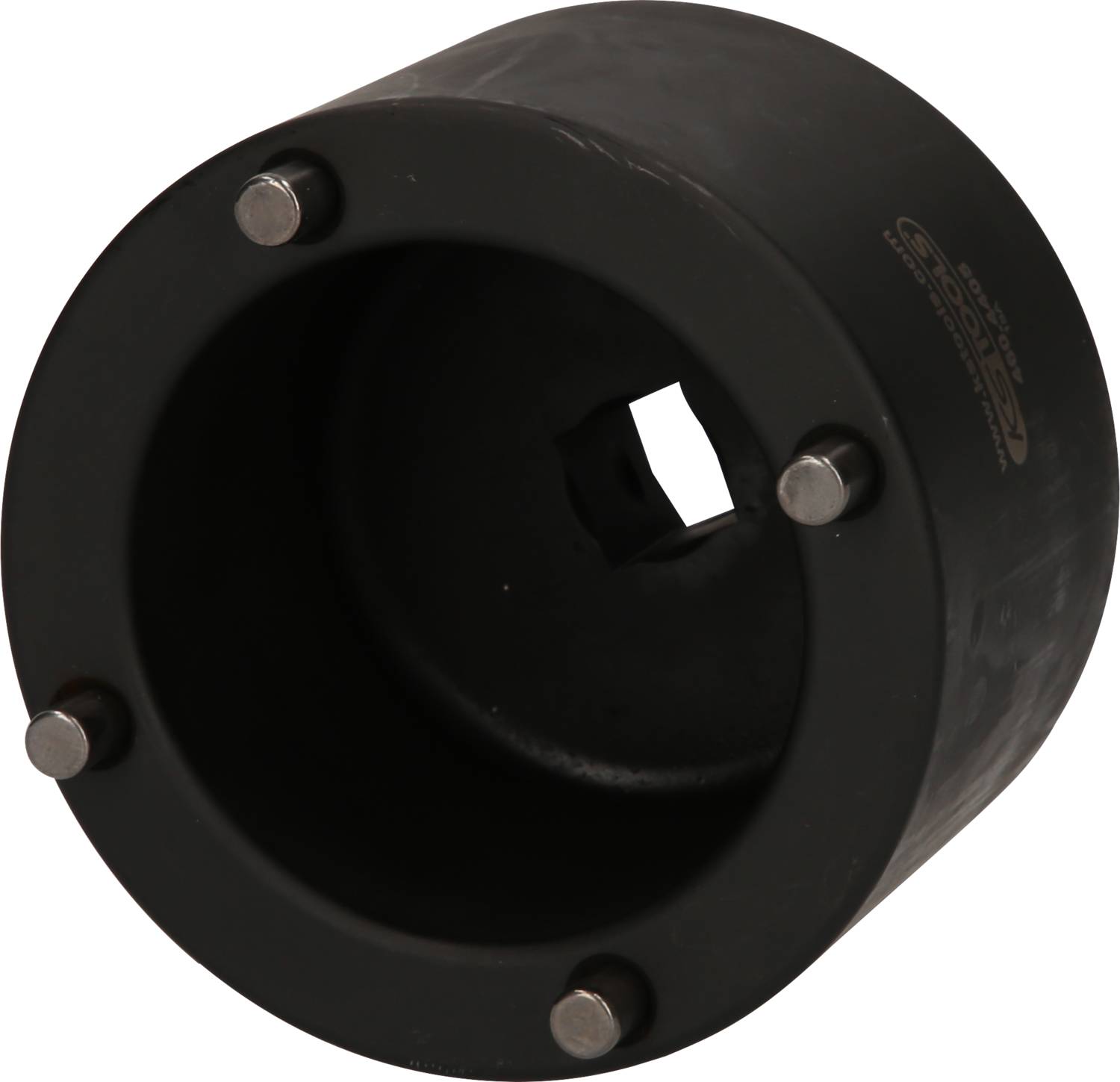 Schwarzes zylindrisches Bauteil mit runden Metallstiften an der Seite, vermutlich ein Werkzeugaufsatz oder Adapter.