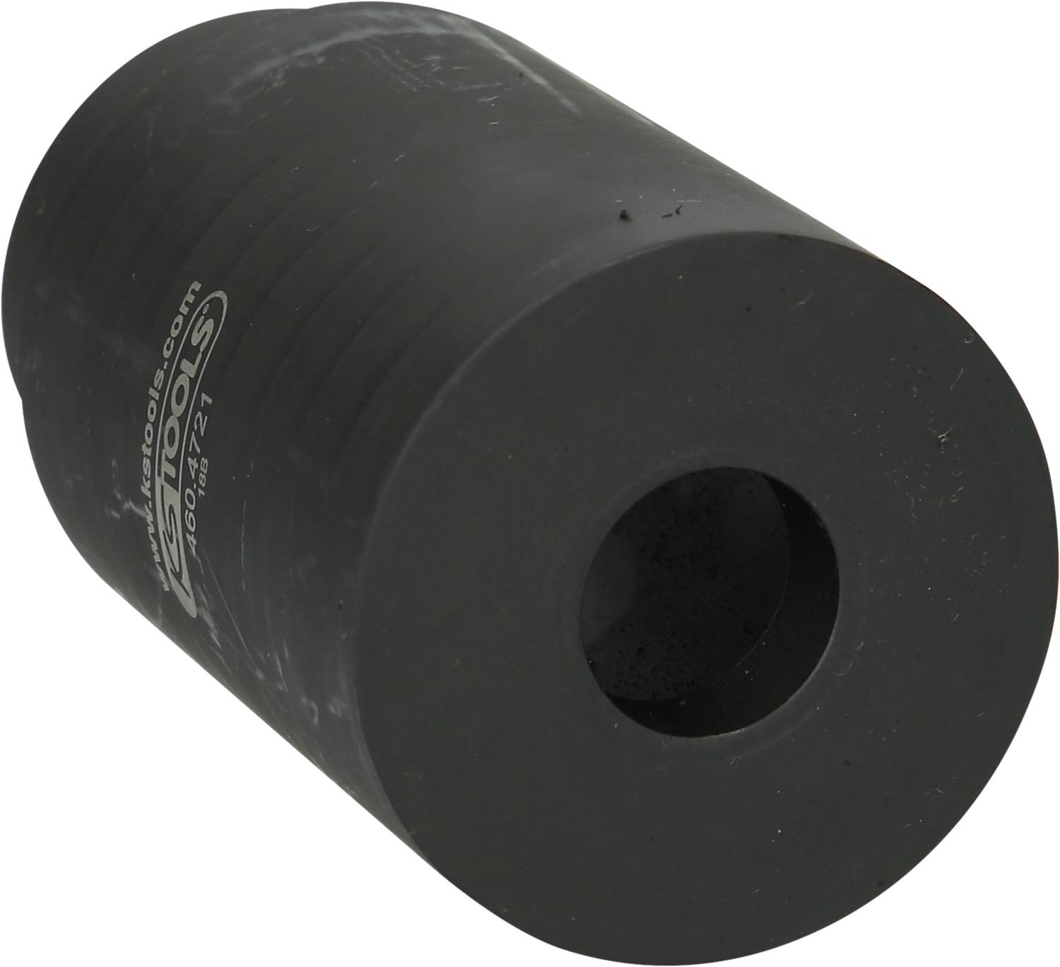 Ein schwarzer zylindrischer Gummipuffer mit einem Loch in der Mitte, verwendet zur Stoßdämpfung.