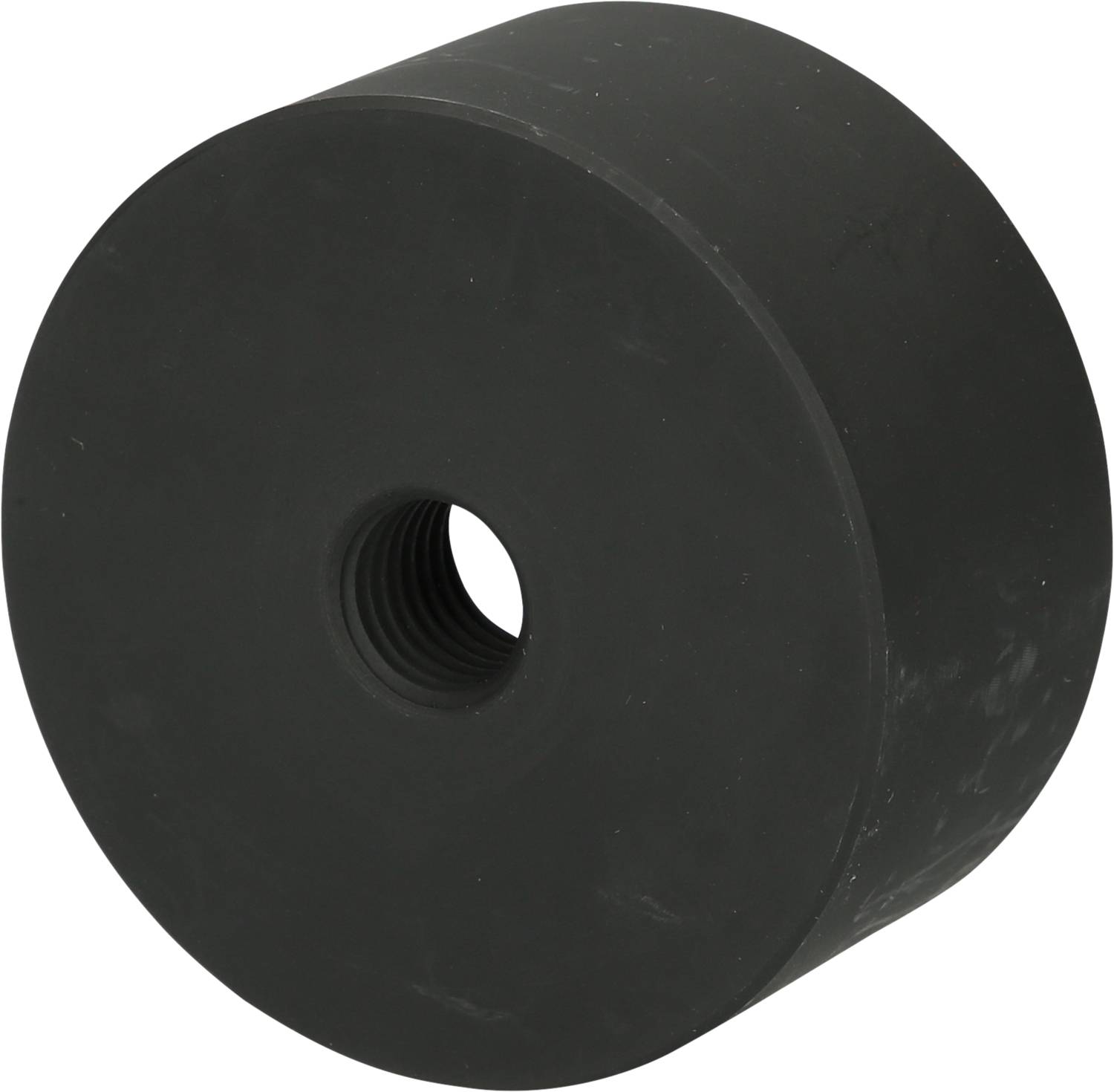 Ein massiver, schwarzer, zylindrischer Gummipuffer mit einem zentralen Gewindeloch, vermutlich zur Dämpfung oder Isolierung gedacht.