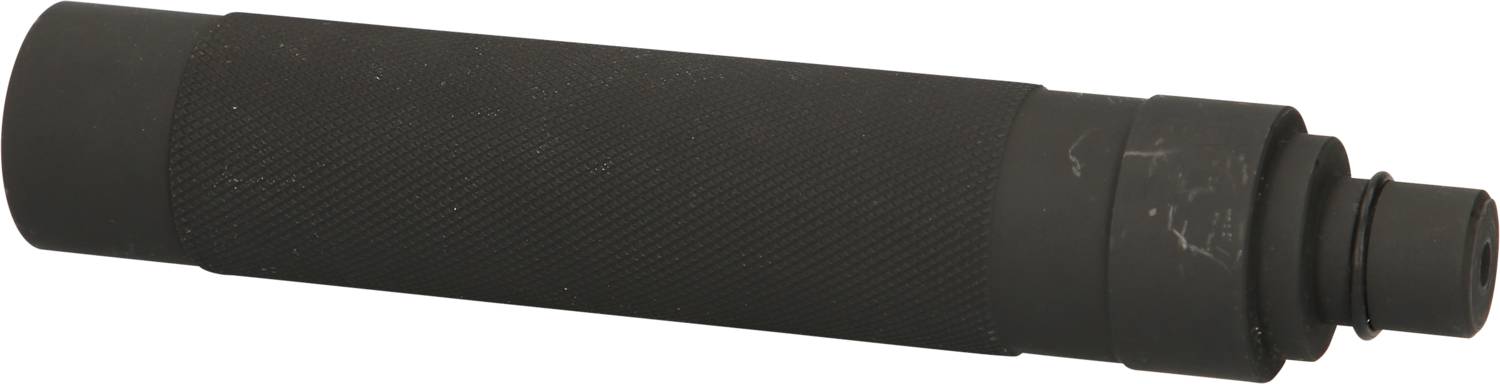 Ein zylinderförmiger, schwarzer Metallgegenstand mit geriffelter Oberfläche und einem herausragenden Ende, vermutlich ein technisches Gerät.