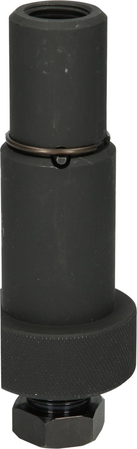 Ein schwarzes, zylindrisches Metallstück mit geriffelter Basis, möglicherweise eine Maschinenteile oder Werkzeug, steht aufrecht.