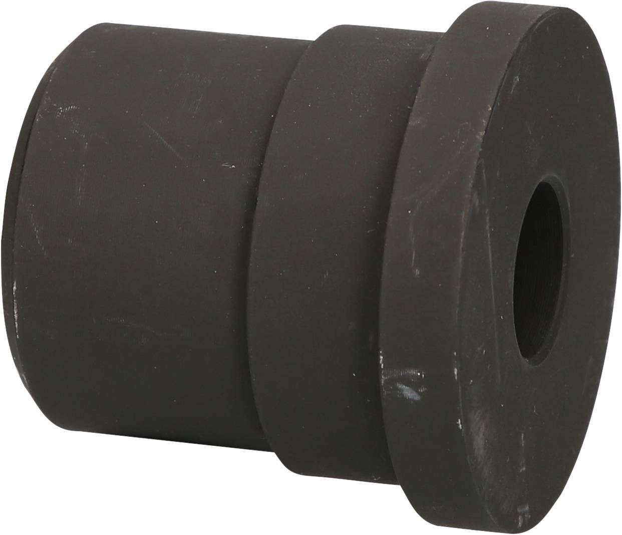 Schwarzes, zylindrisches Gummibauteil mit einem Loch in der Mitte, möglicherweise Dämpfungselement oder Dichtung für Maschinen.