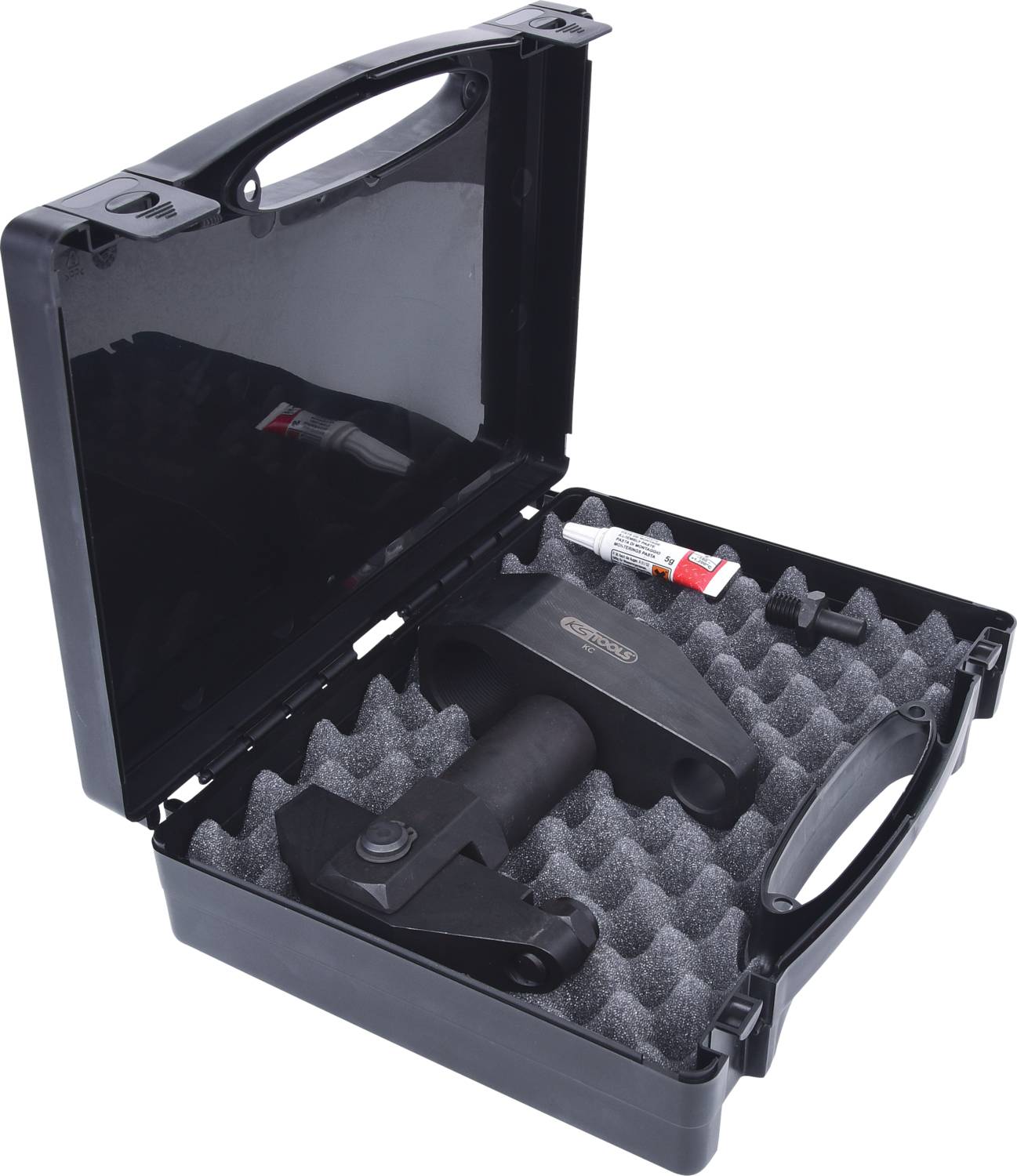 Ein schwarzer Koffer mit Schaumstoffeinlage enthält ein Werkzeug und Zubehör. Ein kleines Röhrchen ist ebenfalls enthalten.